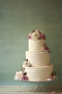 Should a bride and groom share the special cake cutting moment? Wedding cake by DAISY CAKES